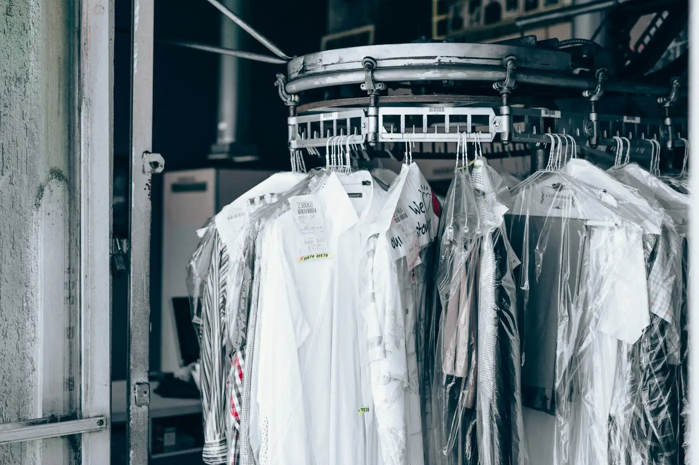 Bagged dry cleaning on a conveyor at the plant