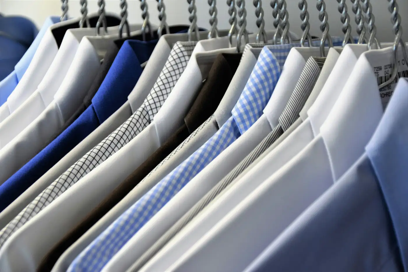 Pressed dress shirts on hangers